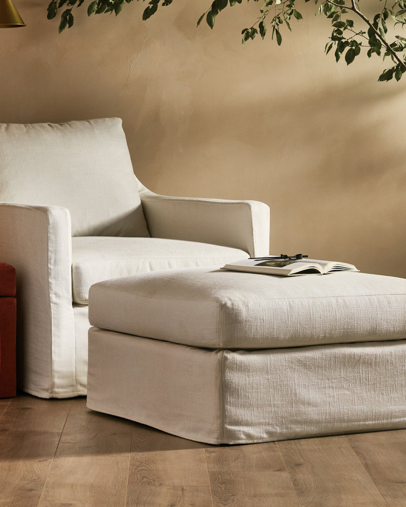 Scene showcasing Laney Slipcover Ottoman