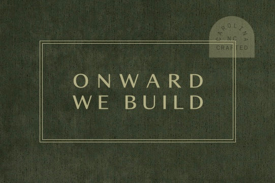 Text based image with the phrase 'Onward we build.'